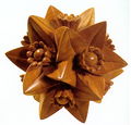 Carved Polyhedron (compound of five tetrahedra) with Flowers (1958)